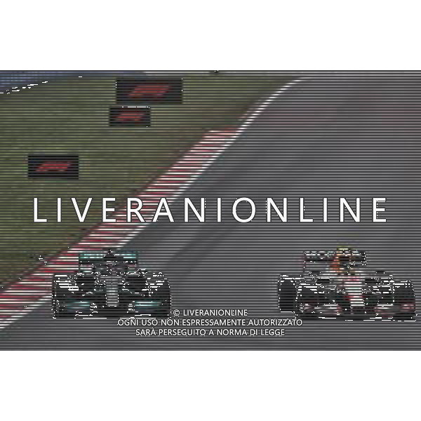 Lewis Hamilton (GBR) Mercedes AMG F1 W12 and Sergio Perez (MEX) Red Bull Racing RB16B battle for position. 10.10.2021. Formula 1 World Championship, Rd 16, Turkish Grand Prix, Istanbul, Turkey, Race Day. - www.xpbimages.com, EMail: requests@xpbimages.com © Copyright: Batchelor / XPB Images/AGENZIA ALDO LIVERANI SAS - ITALY ONLY EDITORIAL USE ONLY