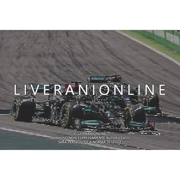 Lewis Hamilton (GBR) Mercedes AMG F1 W12 passes team mate Valtteri Bottas (FIN) Mercedes AMG F1 W12. 14.11.2021. Formula 1 World Championship, Rd 19, Brazilian Grand Prix, Sao Paulo, Brazil, Race Day. - www.xpbimages.com, EMail: requests@xpbimages.com © Copyright: Batchelor / XPB Images/AGENZIA ALDO LIVERANI SAS - ITALY ONLY EDITORIAL USE ONLY
