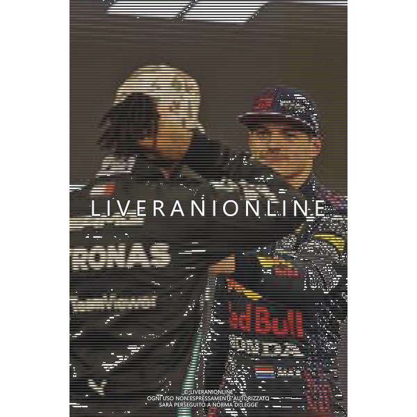 Max Verstappen (NLD) Red Bull Racing celebrates his pole position with second placed Lewis Hamilton (GBR) Mercedes AMG F1 in qualifying parc ferme. 11.12.2021. Formula 1 World Championship, Rd 22, Abu Dhabi Grand Prix, Yas Marina Circuit, Abu Dhabi, Qualifying Day. - www.xpbimages.com, EMail: requests@xpbimages.com © Copyright: Moy / XPB Images/AGENZIA ALDO LIVERANI SAS - ITALY ONLY EDITORIAL USE ONLY