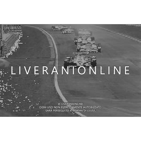 GRAN PREMIO DI SAN MARINO CAMPIONATO MONDIALE DI FORMULA 1, AUTODROMO DI IMOLA 3 MAGGIO 1981 - RETROSPETTIVA Nella foto il pilota Alan Jones su McLaren-Ford Cosworth e Riccardo Patrese ©Archivio Giovanni Liverani/AGENZIA ALDO LIVERANI SAS