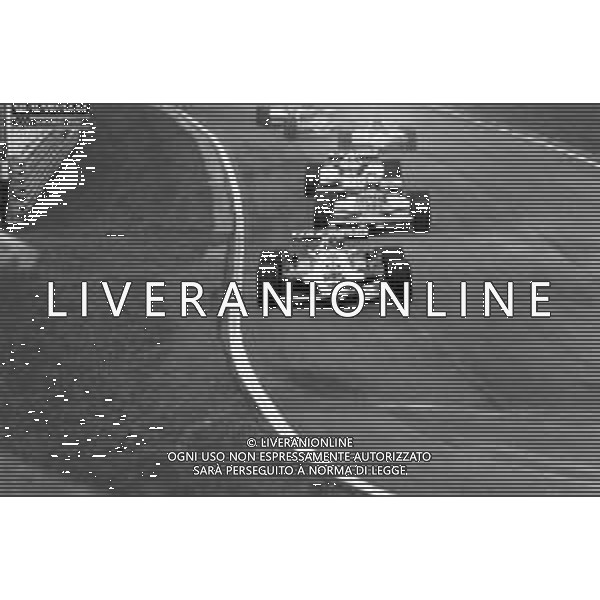 GRAN PREMIO DI SAN MARINO CAMPIONATO MONDIALE DI FORMULA 1, AUTODROMO DI IMOLA 3 MAGGIO 1981 - RETROSPETTIVA Nella foto il pilota Alan Jones su McLaren-Ford Cosworth e Riccardo Patrese ©Archivio Giovanni Liverani/AGENZIA ALDO LIVERANI SAS