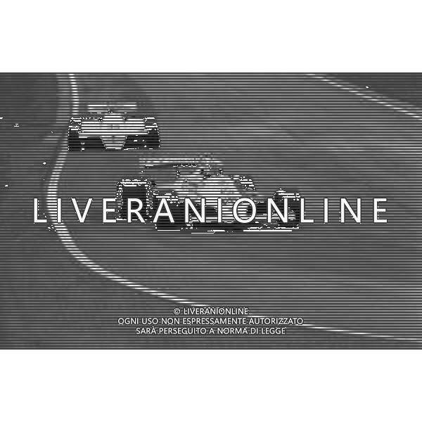 GRAN PREMIO DI SAN MARINO CAMPIONATO MONDIALE DI FORMULA 1, AUTODROMO DI IMOLA 3 MAGGIO 1981 - RETROSPETTIVA Nella foto il pilota Alan Jones su McLaren-Ford Cosworth e Patrick Tambay ©Archivio Giovanni Liverani/AGENZIA ALDO LIVERANI SAS