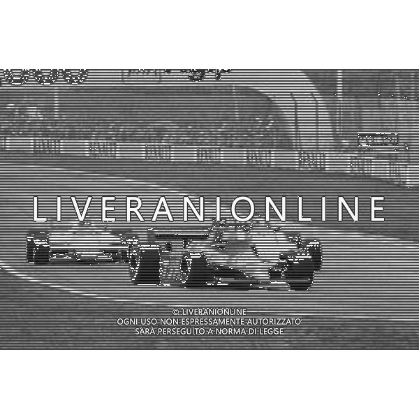 GRAN PREMIO DI SAN MARINO CAMPIONATO MONDIALE DI FORMULA 1, AUTODROMO DI IMOLA 3 MAGGIO 1981 - RETROSPETTIVA Nella foto il pilota Michele Alboreto su Tyrrell-Ford Cosworth e Beppe Gabbiani ©Archivio Giovanni Liverani/AGENZIA ALDO LIVERANI SAS