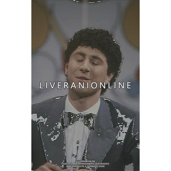 RETROSPETTIVA FABIO AGOSTINO FRANCESCO FAZIO CONDUTTORE TELEVISIVO-IMITATORE-SCRITTORE E PRODUTTORE ARTISTICO NELLA FOTO FABIO FAZIO NELL\'ANNO 1984 NELLA TRASIMISSIONE TELEVISIVA "LORETTA GOGGI IN QUIZ“ AG ALDO LIVERANI SAS