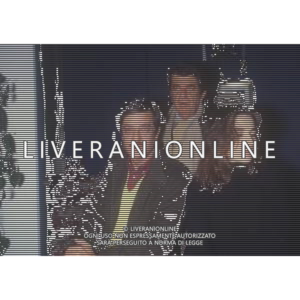 RETROSPETTIVA GIANCARLO GIANNINI ATTORE NELLA FOTO GIANCARLO GIANNINI CON NANNI LOI E LINA SASTRI NELL\'ANNO 1984 IN TERRAZZA MARTINI A MILANO AG ALDO LIVERANI SAS 