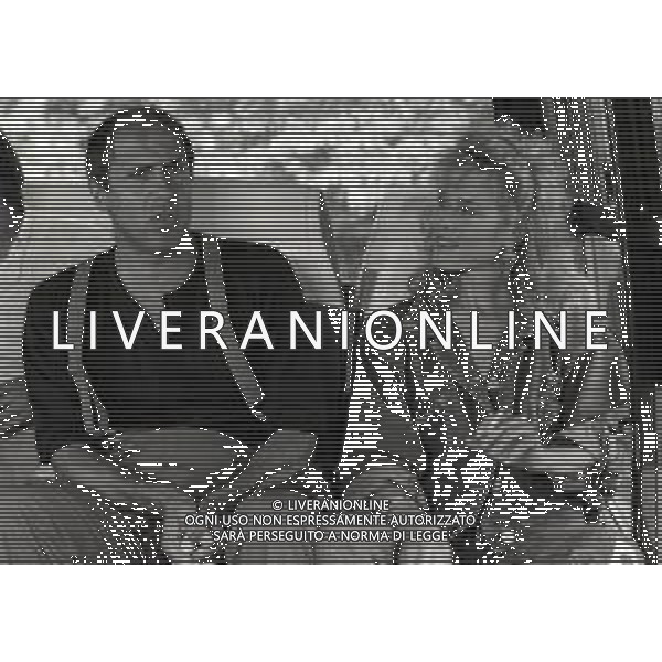 RETROSPETTIVA ADRIANO CELENTANO ATTORE CANTANTE  NELLA FOTO ADRIANO CELENTANO CON DEBRA FEUER NELL\'ANNO 1984 A ROMA SUL SET DEL FILM “IL BURBERO“ AG ALDO LIVERANI SAS 