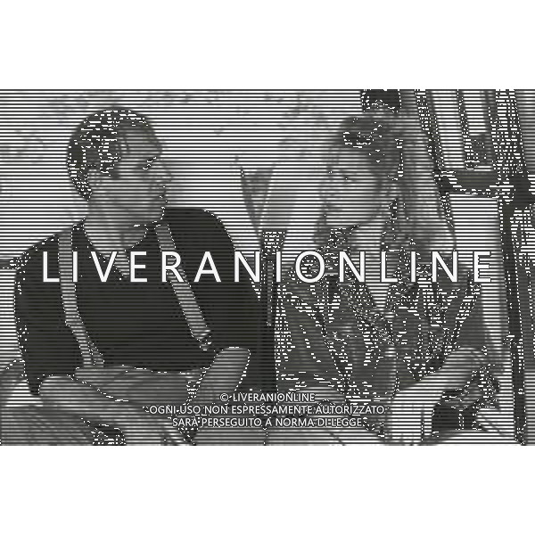 RETROSPETTIVA ADRIANO CELENTANO ATTORE CANTANTE  NELLA FOTO ADRIANO CELENTANO CON DEBRA FEUER NELL\'ANNO 1984 A ROMA SUL SET DEL FILM “IL BURBERO“ AG ALDO LIVERANI SAS 