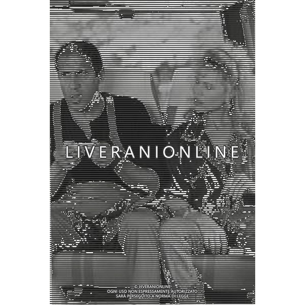 RETROSPETTIVA ADRIANO CELENTANO ATTORE CANTANTE  NELLA FOTO ADRIANO CELENTANO CON DEBRA FEUER NELL\'ANNO 1984 A ROMA SUL SET DEL FILM “IL BURBERO“ AG ALDO LIVERANI SAS 