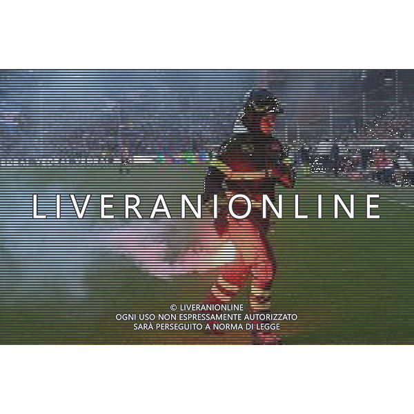 Danilo Vigo/LMedia - UC Sampdoria vs Genoa CFC - italian soccer Serie A match 2021/2022 April 30 2022 - Luigi Ferraris stadium Genova, Italy UC Sampdoria vs Genoa CFC Photo showing: Firefighter recovers smoke bomb in the field - i pompieri cercano di spegnere i fumogeni buttati in campo dai tifosi @Danilo Vigo/LiveMedia /AGENZIA ALDO LIVERANI SAS