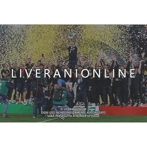 Emmanuele Mastrodonato/LMedia - US Lecce vs Pordenone Calcio - Italian soccer Serie B match 2021/2022 May 06 2022 - Stadio Via del Mare Lecce, Italy US Lecce vs Pordenone Calcio Photo showing: Captain Fabio Lucioni (US Lecce) raises the cup to the sky for the victory of the Serie B 2021/2022 championship @Emmanuele Mastrodonato/LiveMedia AG ALDO LIVERANI SAS