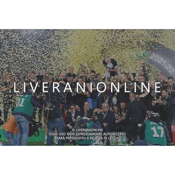 Emmanuele Mastrodonato/LMedia - US Lecce vs Pordenone Calcio - Italian soccer Serie B match 2021/2022 May 06 2022 - Stadio Via del Mare Lecce, Italy US Lecce vs Pordenone Calcio Photo showing: Captain Fabio Lucioni (US Lecce) raises the cup to the sky for the victory of the Serie B 2021/2022 championship @Emmanuele Mastrodonato/LiveMedia AG ALDO LIVERANI SAS