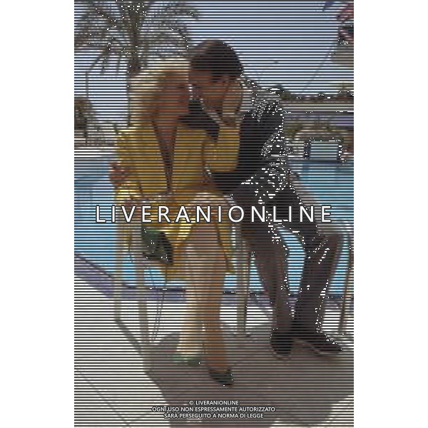 RETROSPETTIVA PIPPO BAUDO PRESENTATORE TELEVISIVO NELLA FOTO CON LA MOGLIE KATIA RICCIARELLI A CANNES NELL\'ANNO 1986 ©ARCHIVIO/AGENZIA ALDO LIVERANI SAS