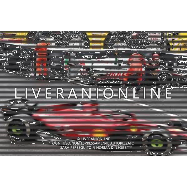 Charles Leclerc (MON) Ferrari F1-75 passed the crashed Haas VF-22 of Mick Schumacher (GER) Haas F1 Team. 29.05.2022. Formula 1 World Championship, Rd 7, Monaco Grand Prix, Monte Carlo, Monaco, Race Day. - www.xpbimages.com, EMail: requests@xpbimages.com © Copyright: Batchelor / XPB Images/AGENZIA ALDO LIVERANI SAS - ITALY ONLY EDITORIAL USE ONLY