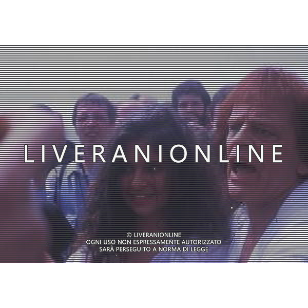RETROSPETTIVA KLAUS KINSKI ATTORE NELLA FOTO KLAUS KINSKI A CANNES NELL\'ANNO 1988 CON DEBORA CAPRIOGLIO AG ALDO LIVERANI SAS 