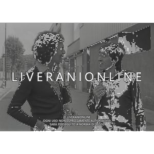 RETROSPETTIVA GIANNI MORANDI CANTANTE NELLA FOTO GIANNI MORANDI CON CHRISTIAN FUORI DALLA SEDE RAI DI MILANO NELL\'ANNO 1975 AG ALDO LIVERANI SAS 