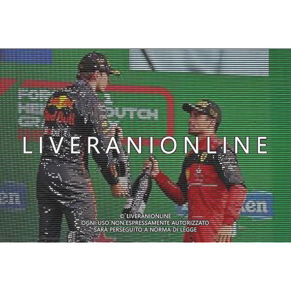 (L to R): race winner Max Verstappen (NLD) Red Bull Racing celebrates on the podium with third placed Charles Leclerc (MON) Ferrari. 04.09.2022. Formula 1 World Championship, Rd 14, Dutch Grand Prix, Zandvoort, Netherlands, Race Day. - www.xpbimages.com, EMail: requests@xpbimages.com © Copyright: Moy / XPB Images/AGENZIA ALDO LIVERANI SAS - ITALY ONLY EDITORIAL USE ONLY