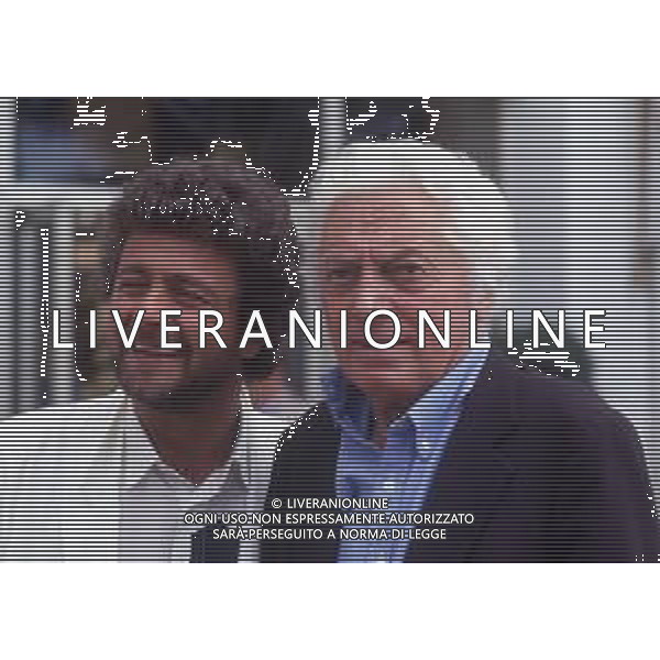 RETROSPETTIVA DINO RISI REGISTA NELLA FOTO DINO RISI A CANNES NELL\'ANNO 1985 CON BEPPE GRILLO AG ALDO LIVERANI SAS