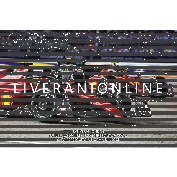 Charles Leclerc (MON) Ferrari F1-75 and Carlos Sainz Jr (ESP) Ferrari F1-75. 02.10.2022. Formula 1 World Championship, Rd 17, Singapore Grand Prix, Marina Bay Street Circuit, Singapore, Race Day. - www.xpbimages.com, EMail: requests@xpbimages.com © Copyright: Charniaux / XPB Images/AGENZIA ALDO LIVERANI SAS - ITALY ONLY EDITORIAL USE ONLY
