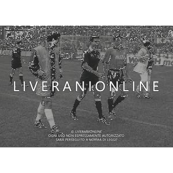 07-10-1990 GENOVA -CAMPIONATO DI CALCIO SERIE A GENOA-NAPOLI 1-1 NELLA FOTO I DUE CAPITANI CIRO FERRARA E STEFANO ERANIO CON L\'ARBITRO ROSARIO LO BELLO CONTROLLANO IL CAMPO DOPO LA PIOGGIA AG ALDO LIVERANI SAS 