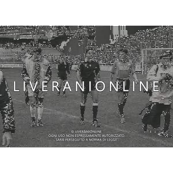 07-10-1990 GENOVA -CAMPIONATO DI CALCIO SERIE A GENOA-NAPOLI 1-1 NELLA FOTO I DUE CAPITANI CIRO FERRARA E STEFANO ERANIO CON L\'ARBITRO ROSARIO LO BELLO CONTROLLANO IL CAMPO DOPO LA PIOGGIA AG ALDO LIVERANI SAS 