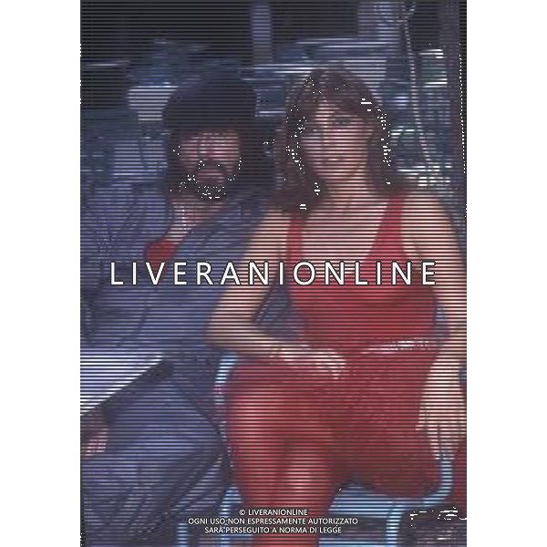 RETROSPETTIVATOMAS MILIAN, PSEUDONIMO DI TOMAS QUINTIN RODRIGUEZ ATTORE NELLA FOTO TOMAS MILIAN A ROMA NELL\'ANNO 1982 CON VIOLA VALENTINO SUL SET DEL FILM“DELITTO SULL\'AUTOSTRADA“ AG ALDO LIVERANI SAS