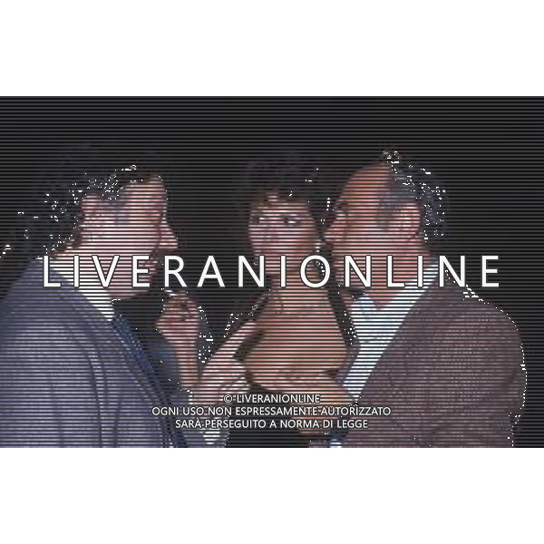 RETROSPETTIVA CLAUDIA CARDINALE ATTRICE NELLA FOTO CON IL MARITO PASQUALE SQUITIERI E GIANNI MINA\' OSPITE DELLA TRASMISSIONE BLITZ - MILANO ANNI \'80 AG ALDO LIVERANI SAS