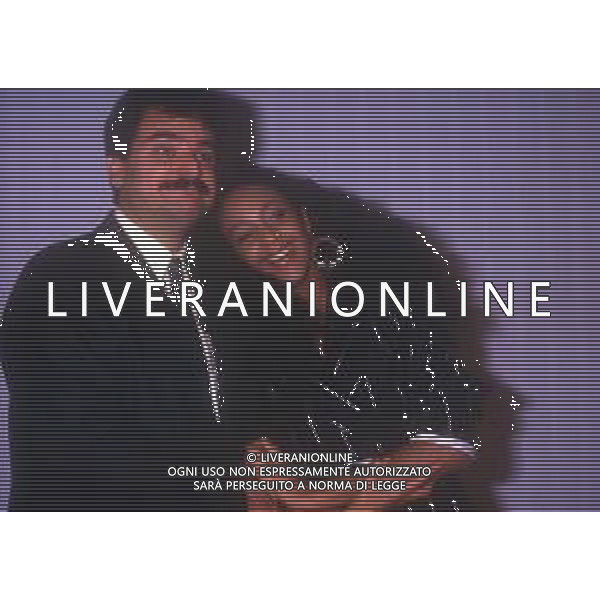 DIAP-RETROSPETTIVA SERGIO VASTANO ATTORE-COMICO NELLA FOTO SERGIO VASTANO CON JOHARA NELL\'ANNO 1987 AG ALDO LIVERANI SAS 