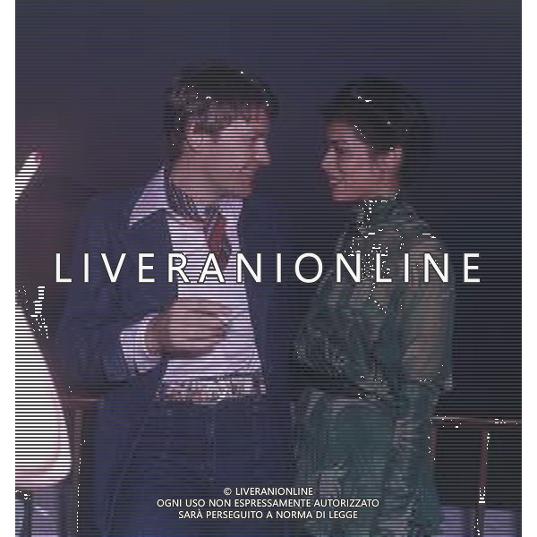 DIAP-RETROSPETTIVA HELMUT BERGER ATTORE NELLA FOTO HELMUT BERGER CON BIANCA JAGGER CANNES IL 1-05-1975 AG ALDO LIVERANI SAS  