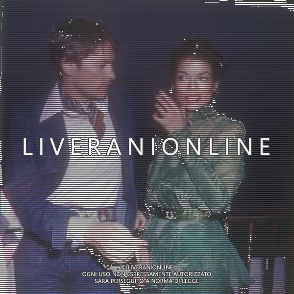 DIAP-RETROSPETTIVA HELMUT BERGER ATTORE NELLA FOTO HELMUT BERGER CON BIANCA JAGGER CANNES IL 1-05-1975 AG ALDO LIVERANI SAS  