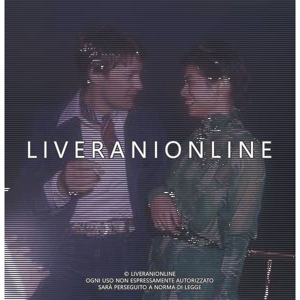 DIAP-RETROSPETTIVA HELMUT BERGER ATTORE NELLA FOTO HELMUT BERGER CON BIANCA JAGGER CANNES IL 1-05-1975 AG ALDO LIVERANI SAS  