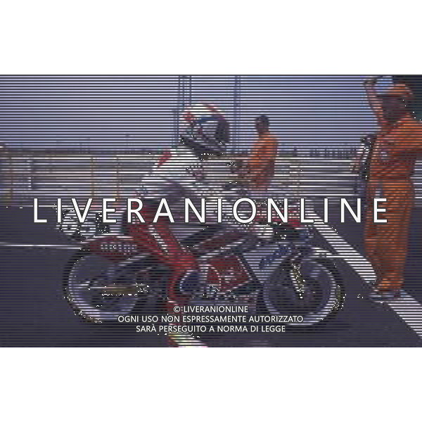RETROSPETTIVA LORIS CAPIROSSI PILOTA MOTO NELLA FOTO LORIS CAPIROSSI NELL\'ANNO 1990 CAMPIONE DEL MONDO CC 125 FOTO CONTROLUCE-AG ALDO LIVERANI SAS