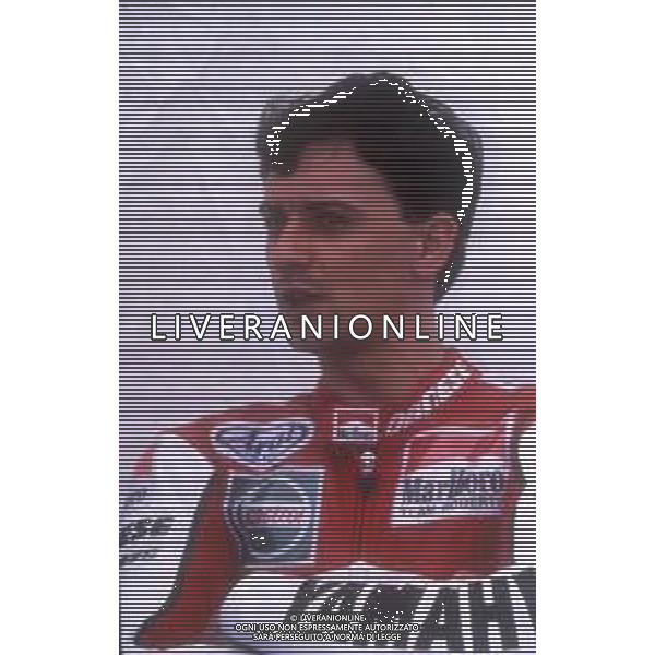 DIAP-RETROSPETTIVA LUCA CADALORA PILOTA MOTO NELLA FOTO LUCA CADALORA NELL\'ANNO 1990 AG CONTROLUCE-AG ALDO LIVERANI SAS 