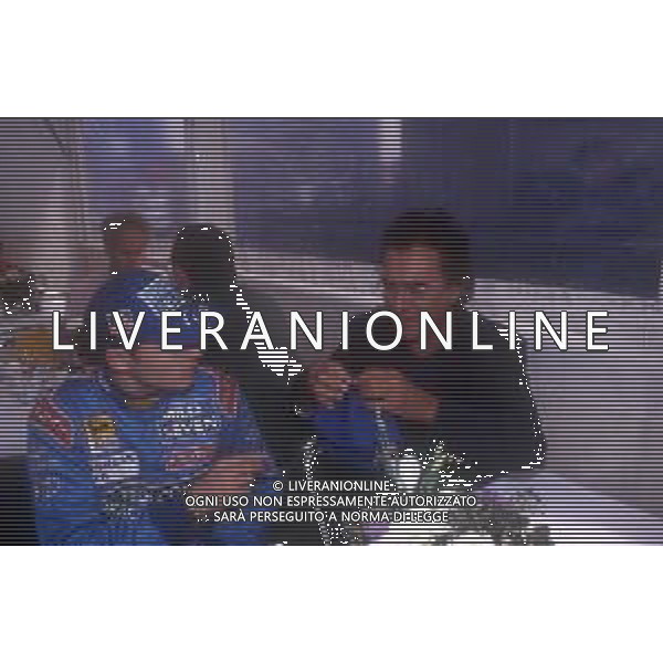 DIAP-RETROSPETTIVA ALBANO CARRISI CANTANTE NELLA FOTO ALBANO CARRISI NELL\'ANNO 1998 AL GP DI MONZA F1 CON GIANCARLO FISICHELLA AG ALDO LIVERANI SAS  