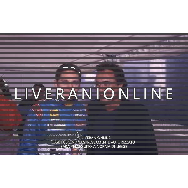 DIAP-RETROSPETTIVA ALBANO CARRISI CANTANTE NELLA FOTO ALBANO CARRISI NELL\'ANNO 1998 AL GP DI MONZA F1 CON GIANCARLO FISICHELLA AG ALDO LIVERANI SAS  