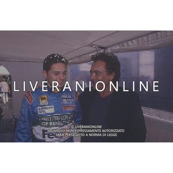 DIAP-RETROSPETTIVA ALBANO CARRISI CANTANTE NELLA FOTO ALBANO CARRISI NELL\'ANNO 1998 AL GP DI MONZA F1 CON GIANCARLO FISICHELLA AG ALDO LIVERANI SAS  