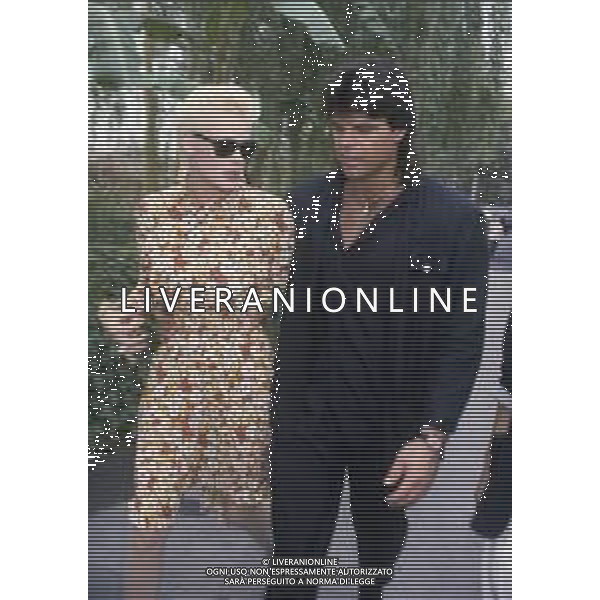 DIAP-RETROSPETTIVA BRIGITTE NIELSEN ATTRICE NELLA FOTO BRIGITTE NIELSEN CON MARK GASTINEAU NELL\'ANNO 1985 A TAORMINA AG ALDO LIVERANI SAS
