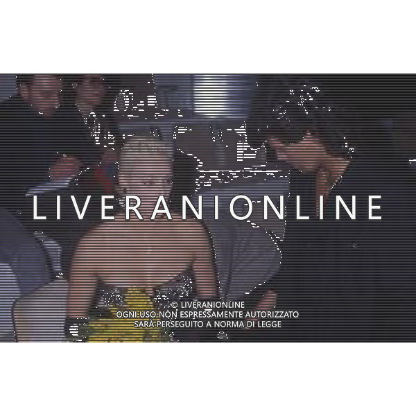 DIAP-RETROSPETTIVA BRIGITTE NIELSEN ATTRICE  NELLA FOTO BRIGITTE NIELSEN CON MARK GASTINEAU NELL\'ANNO 1988 A MILANO AG ALDO LIVERANI SAS