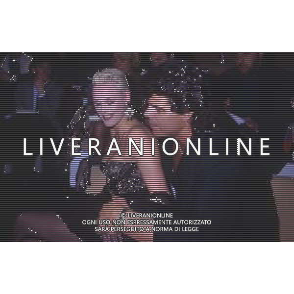 DIAP-RETROSPETTIVA BRIGITTE NIELSEN ATTRICE  NELLA FOTO BRIGITTE NIELSEN CON MARK GASTINEAU NELL\'ANNO 1988 A MILANO AG ALDO LIVERANI SAS