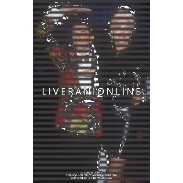 DIAP-RETROSPETTIVA BRIGITTE NIELSEN ATTRICE NELLA FOTO BRIGITTE NIELSEN CON EZIO GREGGIO NELL\'ANNO 1989 A MILANO TRASMISSIONE TELEVISIVA “ODIENS“ AG ALDO LIVERANI SAS 