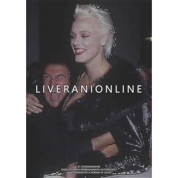 DIAP-RETROSPETTIVA BRIGITTE NIELSEN ATTRICE NELLA FOTO BRIGITTE NIELSEN CON JIMMY IL FENOMENO NELL\'ANNO 1989 A MILANO TRASMISSIONE TELEVISIVA “ODIENS“ AG ALDO LIVERANI SAS 