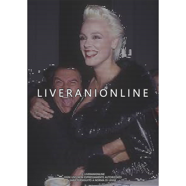 DIAP-RETROSPETTIVA BRIGITTE NIELSEN ATTRICE NELLA FOTO BRIGITTE NIELSEN CON JIMMY IL FENOMENO NELL\'ANNO 1989 A MILANO TRASMISSIONE TELEVISIVA “ODIENS“ AG ALDO LIVERANI SAS 