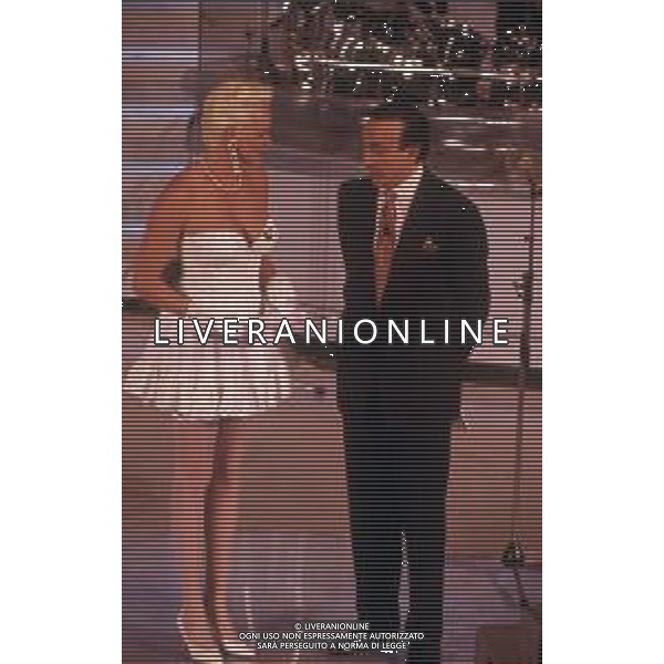 DIAP-RETROSPETTIVA BRIGITTE NIELSEN ATTRICE NELLA FOTO BRIGITTE NIELSEN CON PIPPO BAUDO NELL\'ANNO 1992 A SANREMO AG ALDO LIVERANI SAS 