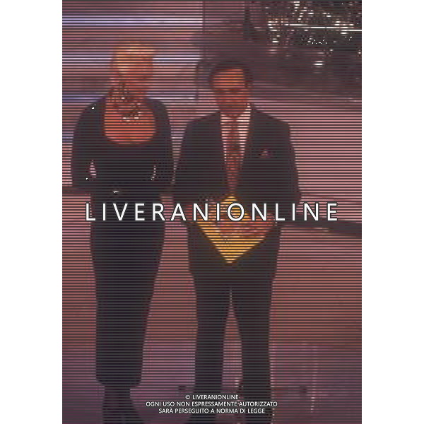 DIAP-RETROSPETTIVA BRIGITTE NIELSEN ATTRICE NELLA FOTO BRIGITTE NIELSEN CON PIPPO BAUDO NELL\'ANNO 1992 A SANREMO AG ALDO LIVERANI SAS 