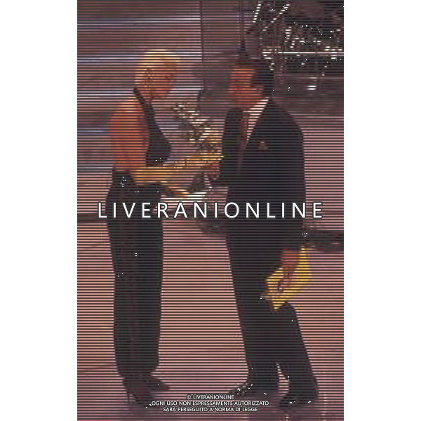 DIAP-RETROSPETTIVA BRIGITTE NIELSEN ATTRICE NELLA FOTO BRIGITTE NIELSEN CON PIPPO BAUDO NELL\'ANNO 1992 A SANREMO AG ALDO LIVERANI SAS  