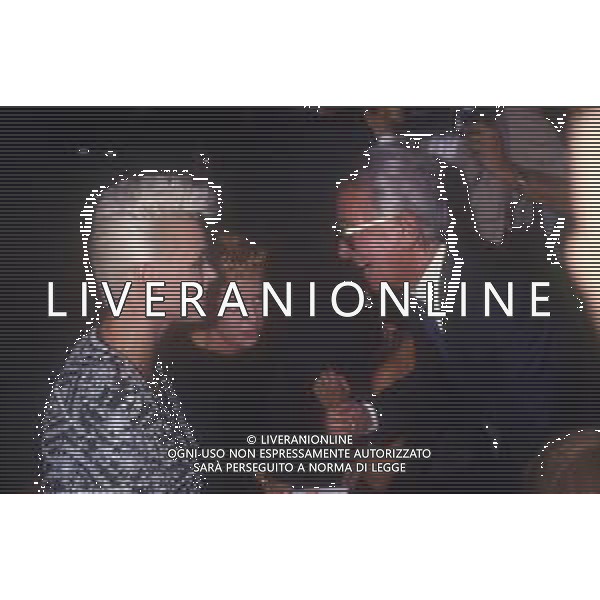 DIAP-RETROSPETTIVA BRIGITTE NIELSEN ATTRICE NELLA FOTO BRIGITTE NIELSEN CON GIULIANO RAVIZZA A MILANO A UNA SFILATA DI MODA AG ALDO LIVERANI SAS 