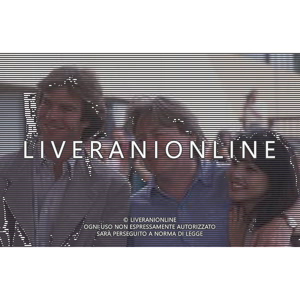 DIAP-RETROSPETTIVA DENNIS QUAID ATTORE NELLA FOTO DENNIS QUAID CON TOMLYN TOMITA E ALAN PARKER A CANNES NELL\'ANNO 1990 AG ALDO LIVERANI SAS
