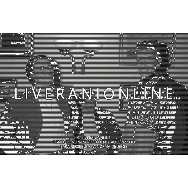 NEG-RETROSPETTIVA ROBERTO VECCHIONI CANTANTE NELLA FOTO ROBERTO VECCHIONI CON PAOLO STRINGARA NELL\'ANNO 1990-1991 AD APPIANO GENTILE IN VISITA AL RITIRO INTER AG ALDO LIVERANI SAS  