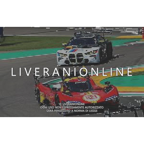 IMOLA 19 04 2024 AUTODROMO ENZO E DINO FERRARI "WEC 6 ORE DI IMOLA"NELLA FOTO FERRARI N∞51 499P ANTONIO GIOVINAZZI DIETRO BMW M4 LMGT3 DI VALENTINO ROSSI ©SANNA / AGENZIA ALDO LIVERANI SAS