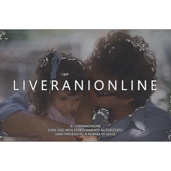DIAP-RETROSPETTIVA RED RONNIE PSEUDONIMO GABRIELE ANSALONI-CRITICO MUSICALE GIORNATISTA PRESENTATORE TELEVISIVO E CONDUTTORE RADIOFONICO NELLA FOTO RED RONNIE CON LA FIGLIA JESSICA NELL\'ANNO 1986 AG ALDO LIVERANI SAS