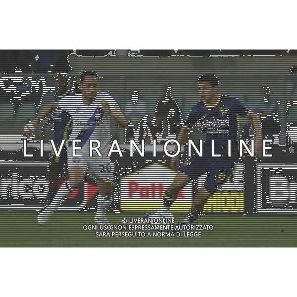 Reda Belahyane of Hellas Verona FC competes for the ball with Hakan Calhanoglu of Inter FC during Hellas Verona FC vs Internazionale FC, 38° Serie A Tim 2023-24 game at Marcantonio Bentegodi Stadium in Verona (VR), Italy, on May 26, 2024. (Photo by Davide Casentini) / AGENZIA ALDO LIVERANI SAS